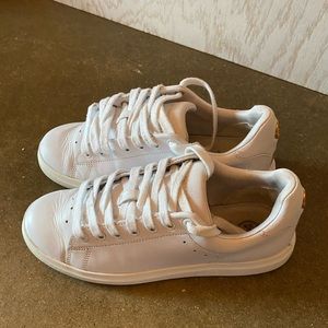 Tory Burch White leather sneaker with TB laces & Tory Burch gold logo on heel.